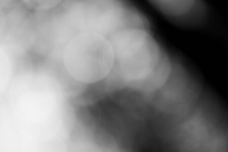 Abstract black bokeh backgroundの写真素材