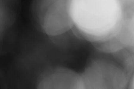 Abstract black bokeh backgroundの写真素材