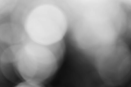 Abstract black bokeh backgroundの写真素材