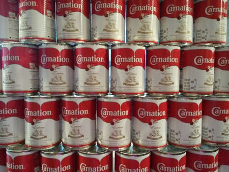BANGKOK, THAILAND - Dec, 31 2019: Close up view of Carnation Brand Sweetened Condensed Milk Orderly Arrangement, Product for cooking and bakery.のeditorial素材