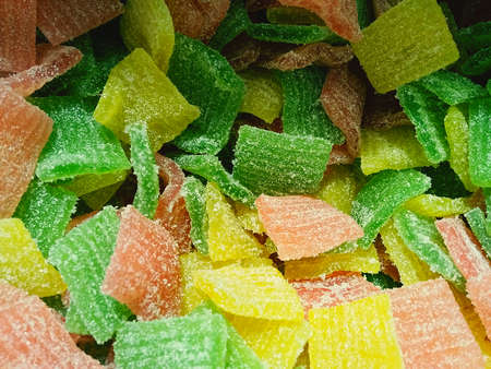 Close up view of colorful gummy fruit jelly in sugar, Candy background.
