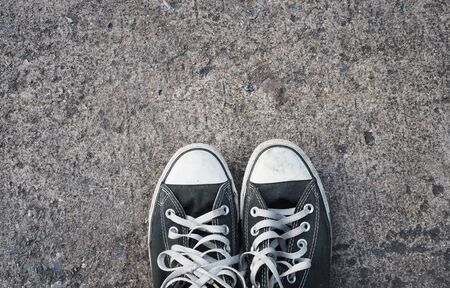 Old sneaker with street backgroundの写真素材