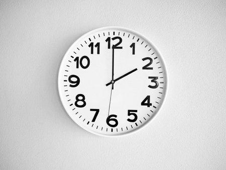 Monochrome clock on the wall for backgroundの写真素材