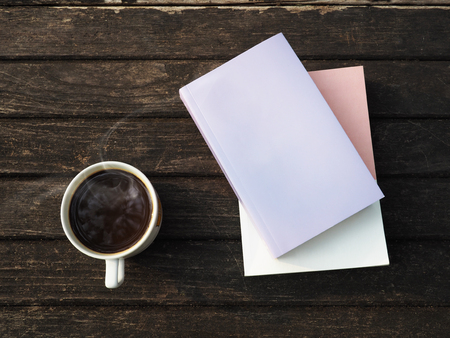 Coffee and books on wood table for backgroundの写真素材