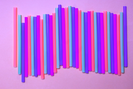 multicolored bar tubes bright fluorescent colors flat lay