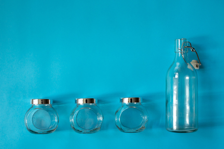 Four empty banks on blue background zero wasteの写真素材