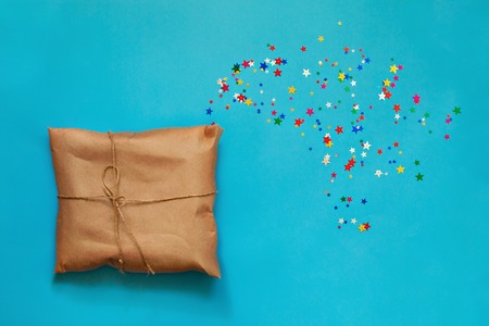 Gift in the new year and asterisks festive celebration backgroundの写真素材