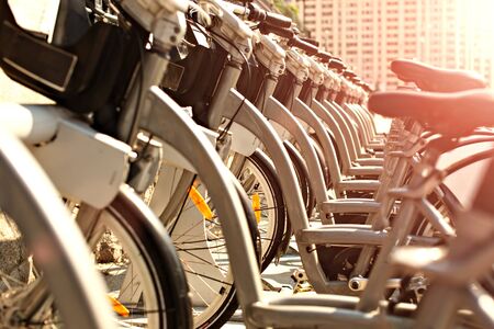Bicycles that abreast waiting for people to travel around the cityの写真素材