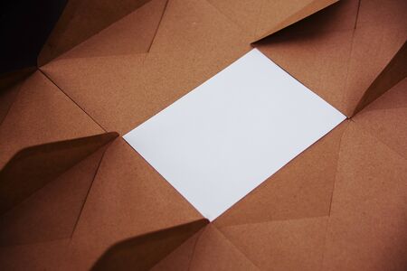 Blank white card with kraft brown paper envelopeの写真素材