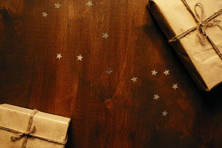 Gift box with ribbon on wooden background