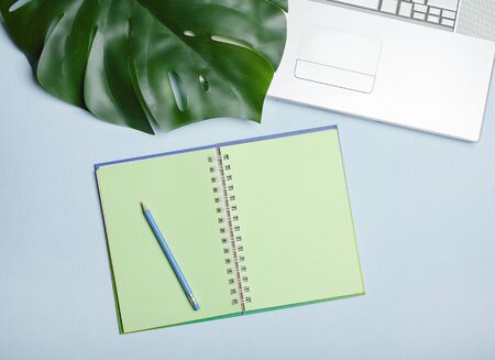 Workplace with notepad and notebook, freelance work conceptの写真素材