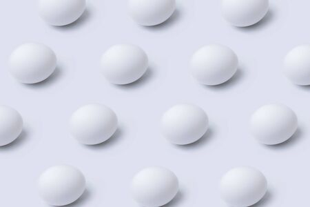 Pattern of eggs on white background, minimal food concept and Easter conceptの写真素材