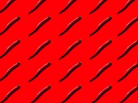 Pattern red chili on red background flat layの写真素材