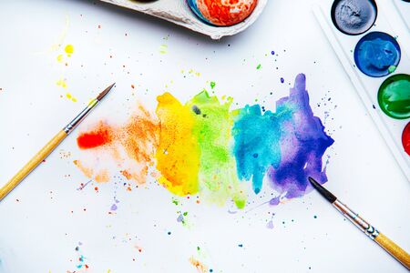 Drawing eggs for Easter on white background, concept of happy holiday and family unificationの写真素材