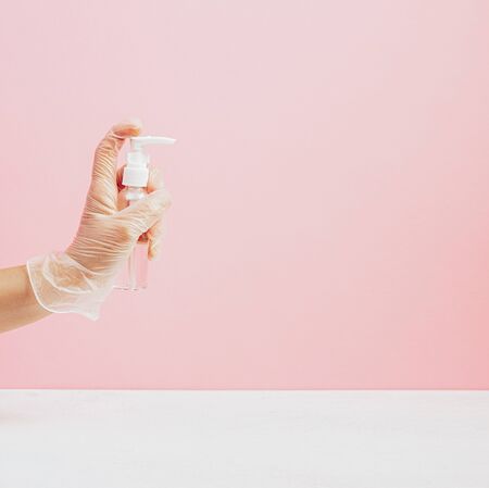 Hand in medical gloves, hand disinfection for safetyの写真素材