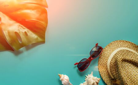 Sun hat glasses and shells with monstera