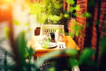 Table in the opening of the cafe. Beginning of the cafe after quarantine in waiting for visitorsの写真素材