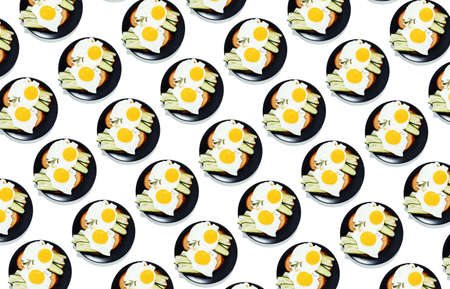 Fried eggs on the plate, healthy breakfast and proper nutrition, patternの写真素材