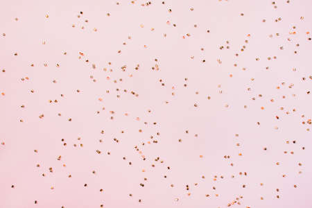 Glitters on a pink background, christmas and new year fun conceptの写真素材
