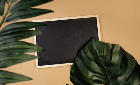 Chalkboard with a place for text on a beige backgroundの写真素材