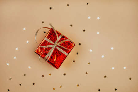 Glitters and present on a pink background, christmas and new year fun conceptの写真素材