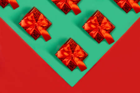 New Years gifts on a green and red background, holiday gifts concept