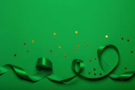 A New Year's background with New Year decorations on green background with space for textの写真素材