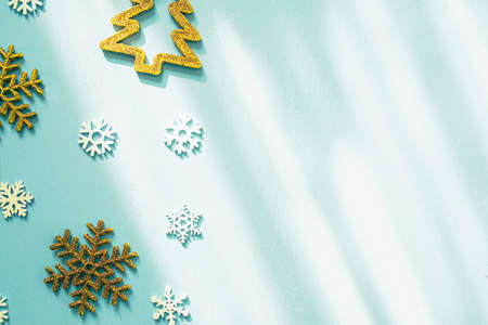 New Year's background with snowflakes on blue wooden background