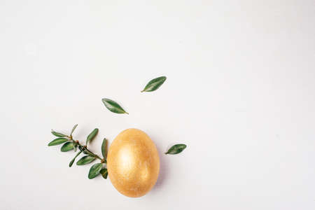 Golden Egg Concept Easter, top view flat lay