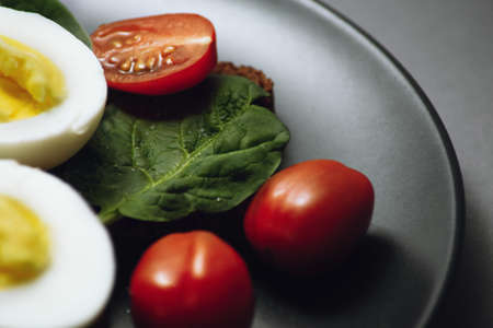 Healthy healthy food with egg. tomato and spinach, vegan food.