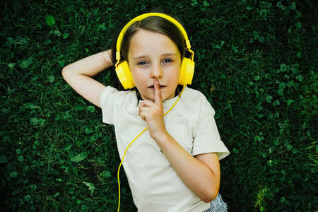 The girl behind the computer in nature, remote learningの写真素材