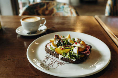 Bruschetta on a table in a cafe, healthy breakfastの写真素材