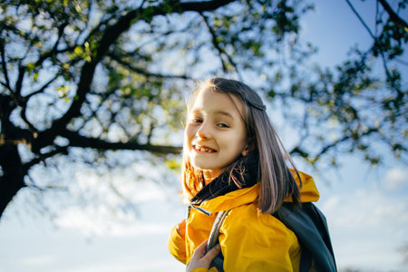 Girl in the woods with a backpack, weekend hike in the woods