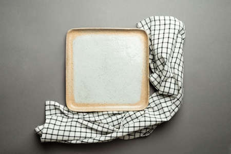 Square plate on kitchen towel top view