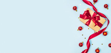 New Year white gift boxes with red ribbon on grey background