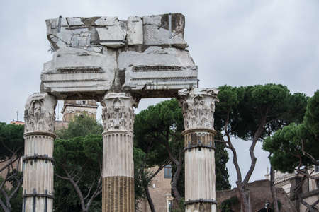 three ancient columns destroyed from time to time with a part of the roof that they heldの写真素材