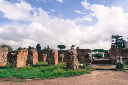 ruined walls of old red brick buildings against a blue skyの写真素材