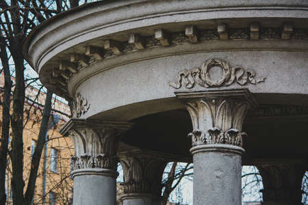 canopy roof with the columns. fragment of a luxurious and gloomy building with stilts and stuccoの写真素材
