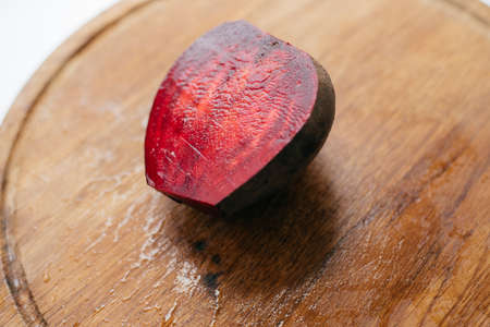 photo of a cut beet on a wooden board