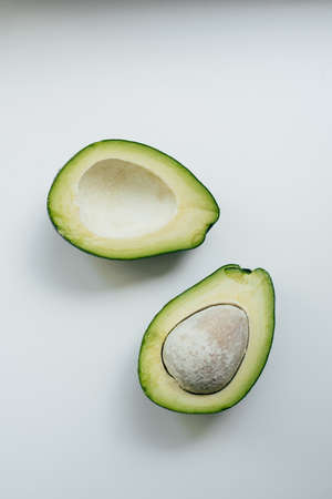 2 half of avocado isolated on a white backgroundの写真素材