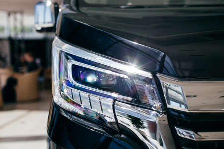 Car's exterior details. shiny headlights on a car