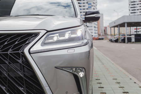 Car's exterior details. shiny headlights on a carの写真素材