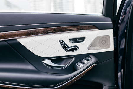 Car interior detail. Closeup of controls on the door