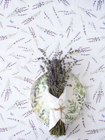 tablecloth with lavender print and serving plate with napkin