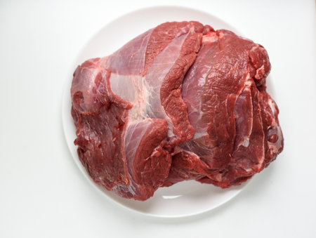 large piece of raw beef on wooden backgroundの写真素材