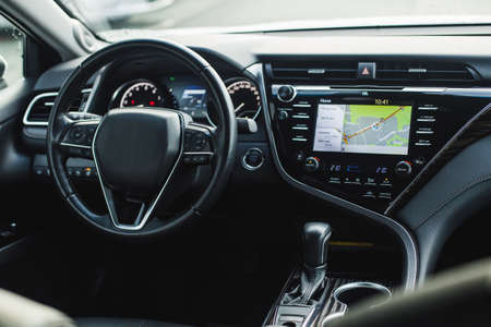 Photo of the interior of the car. Steering wheel, dashboard.