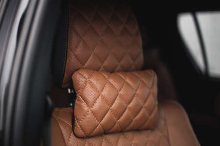 car interior with quilted brown leather seatsの写真素材
