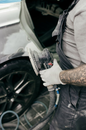 car polishing with a special nozzle in the workshop