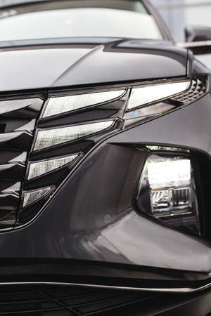 Led car headlight close-up. New modern vehicle detail of lamps light