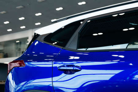 Side view of turning luxury blue carの写真素材